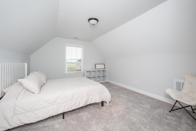 bedroom featuring lofted ceiling, carpet flooring, visible vents, and baseboards