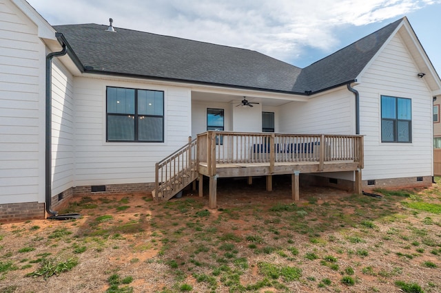 back of house with crawl space, a deck, a ceiling fan, and roof with shingles