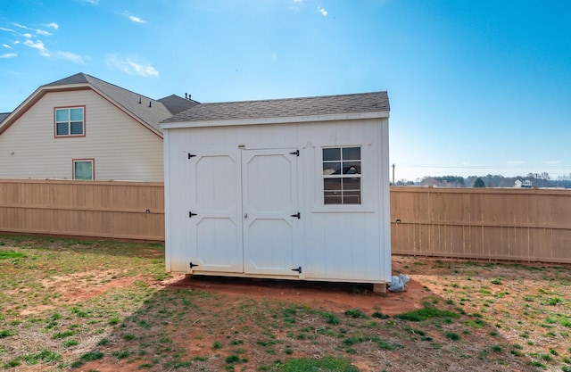 view of shed with fence