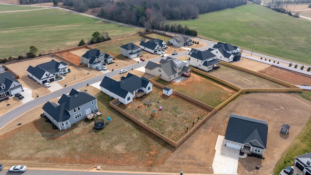 birds eye view of property featuring a rural view and a residential view