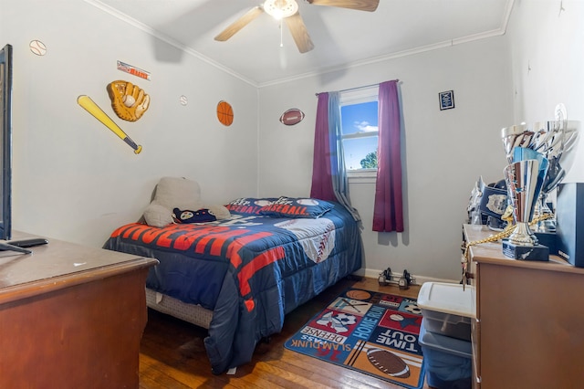 bedroom featuring hardwood / wood-style flooring, ceiling fan, baseboards, and crown molding