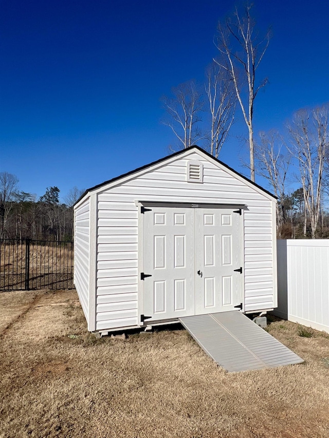 view of shed featuring a fenced backyard