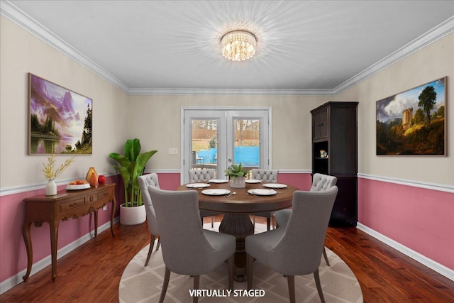 dining space featuring ornamental molding, wood finished floors, and baseboards