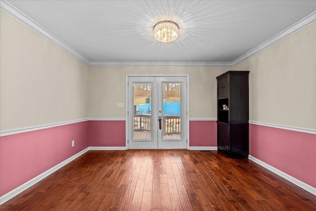 unfurnished room featuring baseboards, french doors, hardwood / wood-style floors, and crown molding