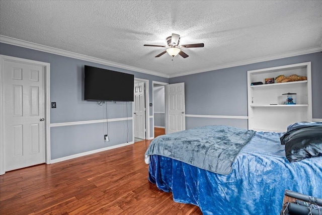 bedroom with crown molding, a textured ceiling, and wood finished floors