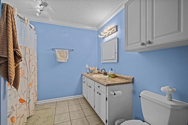 bathroom featuring toilet, ornamental molding, vanity, a textured ceiling, and tile patterned floors