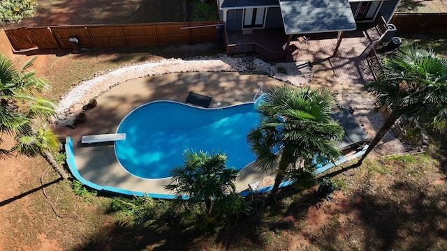 view of pool featuring fence