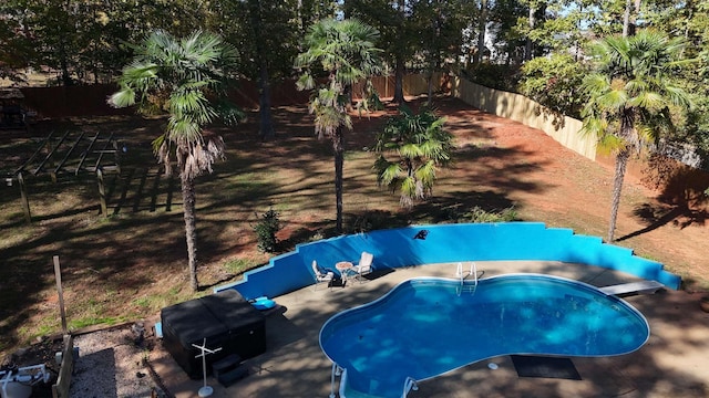 view of swimming pool featuring a diving board, a patio, a fenced backyard, and a fenced in pool