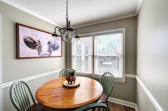 dining room with a healthy amount of sunlight, a notable chandelier, baseboards, and a textured ceiling