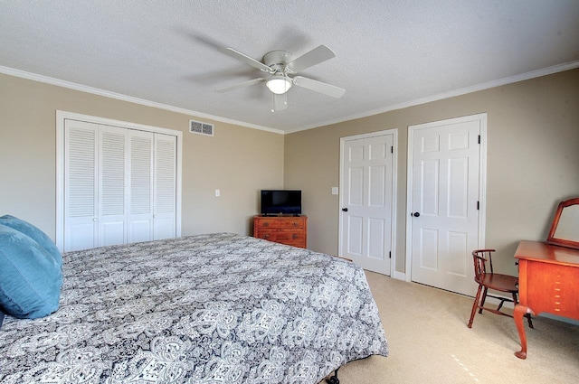 bedroom featuring visible vents, ornamental molding, a closet, and light colored carpet