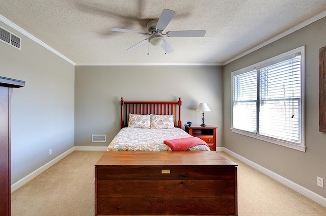 bedroom with light carpet, visible vents, and crown molding