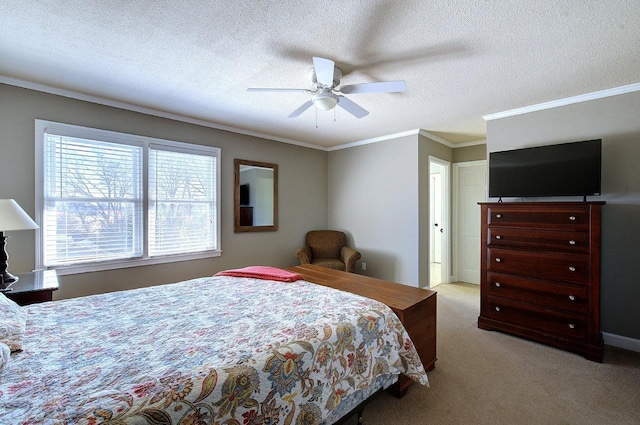 carpeted bedroom with a textured ceiling, a ceiling fan, and crown molding