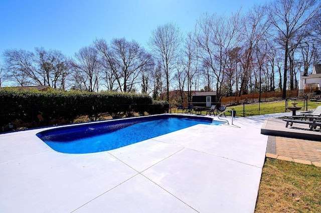 view of pool with fence, a fenced in pool, and a patio