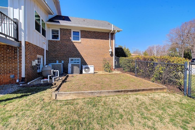 exterior space with ac unit and fence