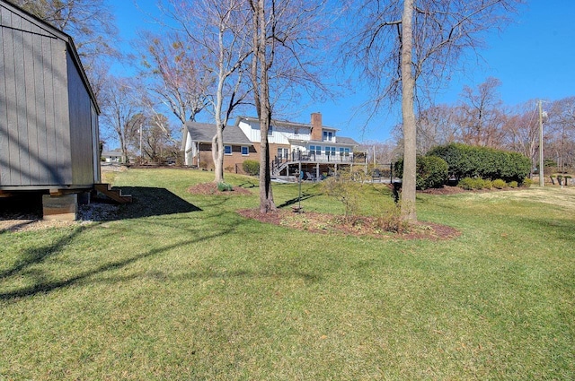view of yard with a wooden deck