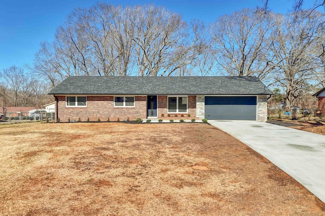 single story home with brick siding, a front yard, fence, a garage, and driveway