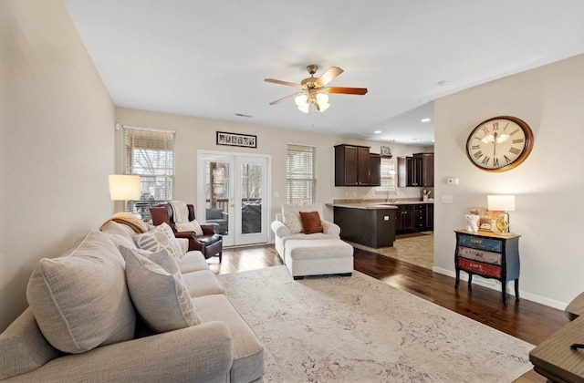 living room featuring french doors, recessed lighting, ceiling fan, wood finished floors, and baseboards