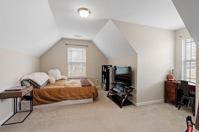 bedroom with lofted ceiling, carpet flooring, visible vents, and multiple windows