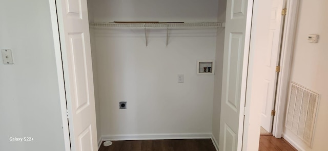 washroom featuring hookup for a washing machine, visible vents, electric dryer hookup, wood finished floors, and laundry area