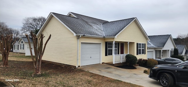 view of front facade featuring a garage, driveway, a porch, and roof with shingles