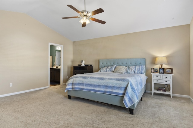 bedroom with carpet, lofted ceiling, ceiling fan, ensuite bath, and baseboards