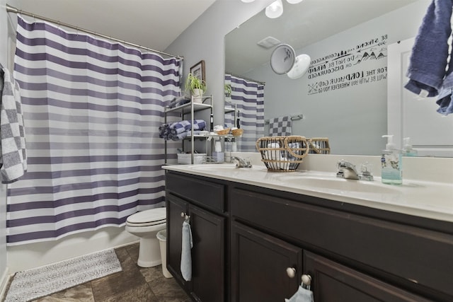 full bathroom featuring shower / bath combination with curtain, a sink, toilet, and double vanity