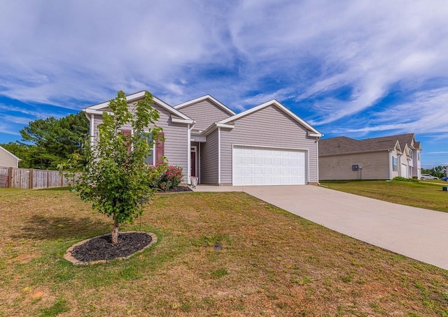 view of front of house with a garage, driveway, fence, and a front lawn