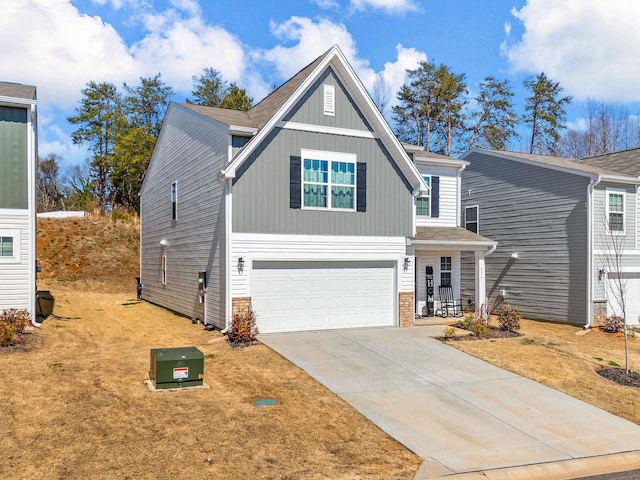 view of front of property with a garage, concrete driveway, and board and batten siding