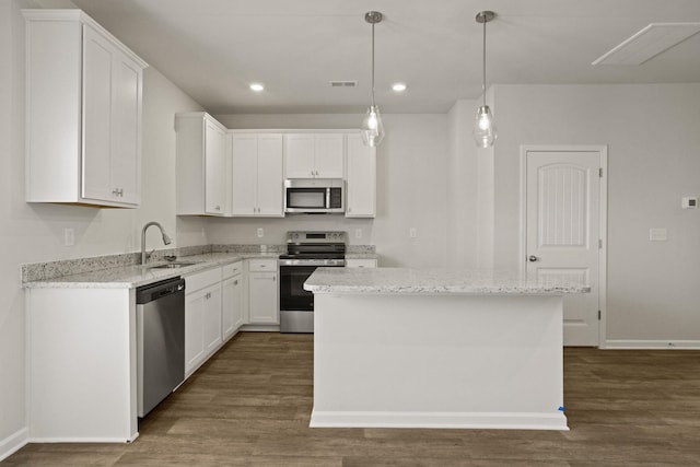 kitchen with dark wood-style floors, visible vents, appliances with stainless steel finishes, and a sink