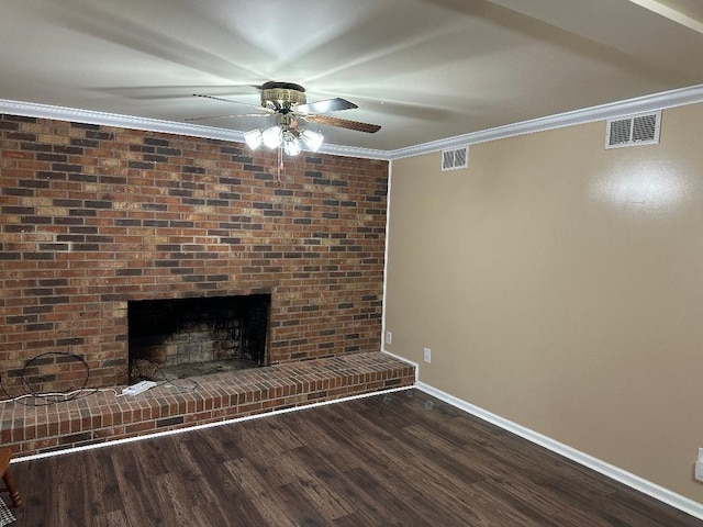 unfurnished living room with dark wood-type flooring, visible vents, and crown molding