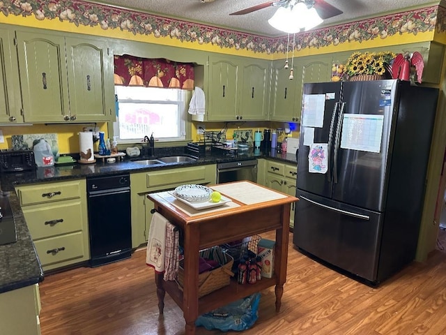 kitchen featuring light wood-style flooring, a sink, green cabinets, black dishwasher, and smart refrigerator