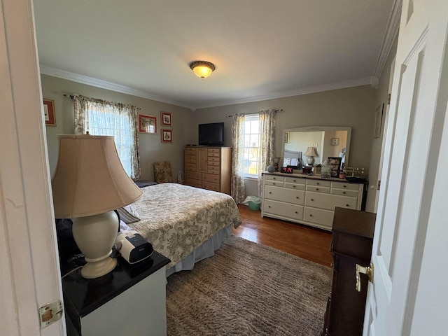 bedroom featuring ornamental molding and dark wood-type flooring