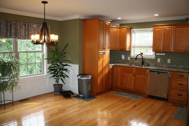 kitchen with a sink, light wood-type flooring, brown cabinetry, and dishwasher