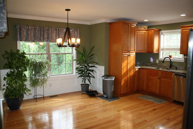 kitchen featuring brown cabinetry, a sink, light wood-style flooring, and dishwasher