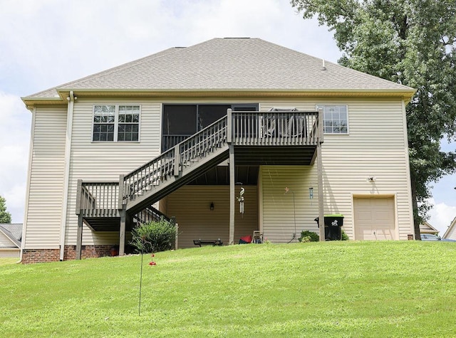 back of property with roof with shingles, a lawn, stairway, and a wooden deck