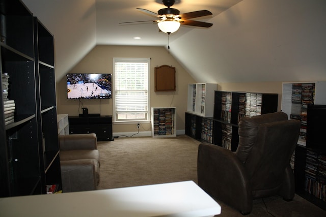 living room with carpet floors, vaulted ceiling, baseboards, and ceiling fan