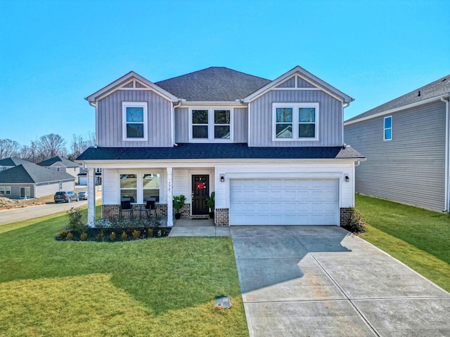 view of front of home featuring a porch, a front lawn, board and batten siding, and an attached garage