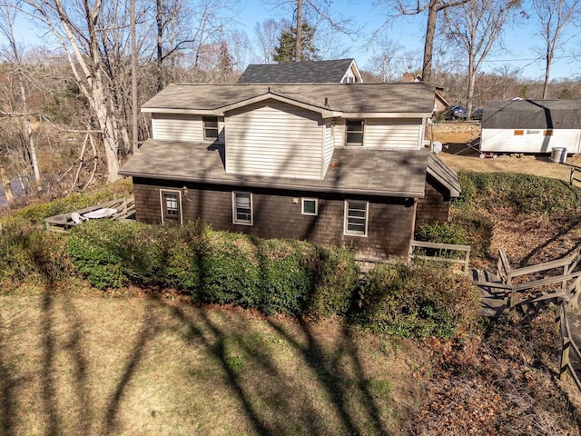 view of home's exterior featuring a shingled roof