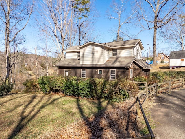 view of property exterior with a yard