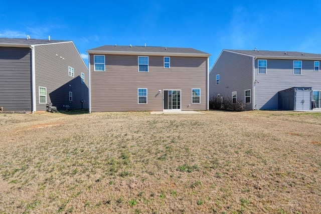 rear view of house with a yard