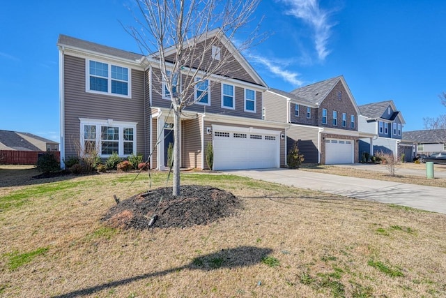 view of front of property with a front yard, driveway, and an attached garage