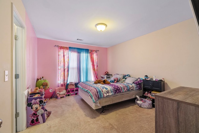 bedroom featuring carpet floors and visible vents