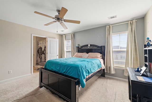 carpeted bedroom with ceiling fan, visible vents, and baseboards