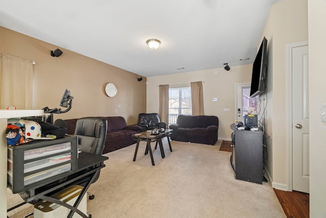 living area with carpet and baseboards