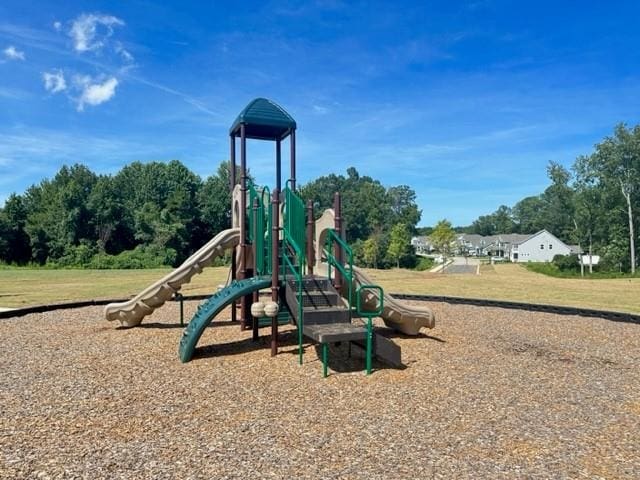 community playground featuring a lawn