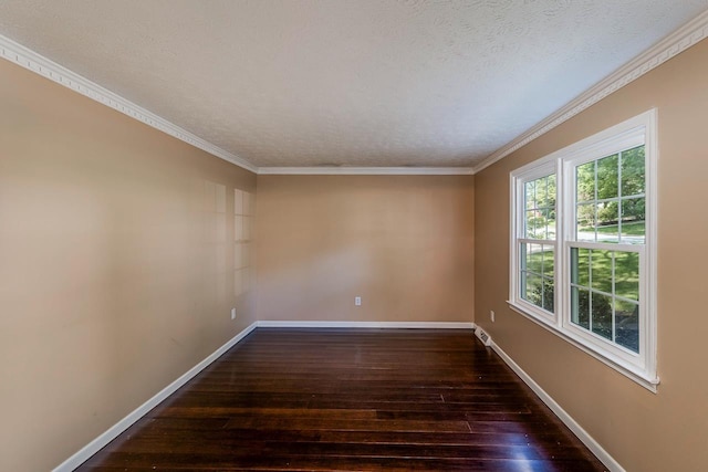 empty room featuring hardwood / wood-style flooring, baseboards, a textured ceiling, and ornamental molding