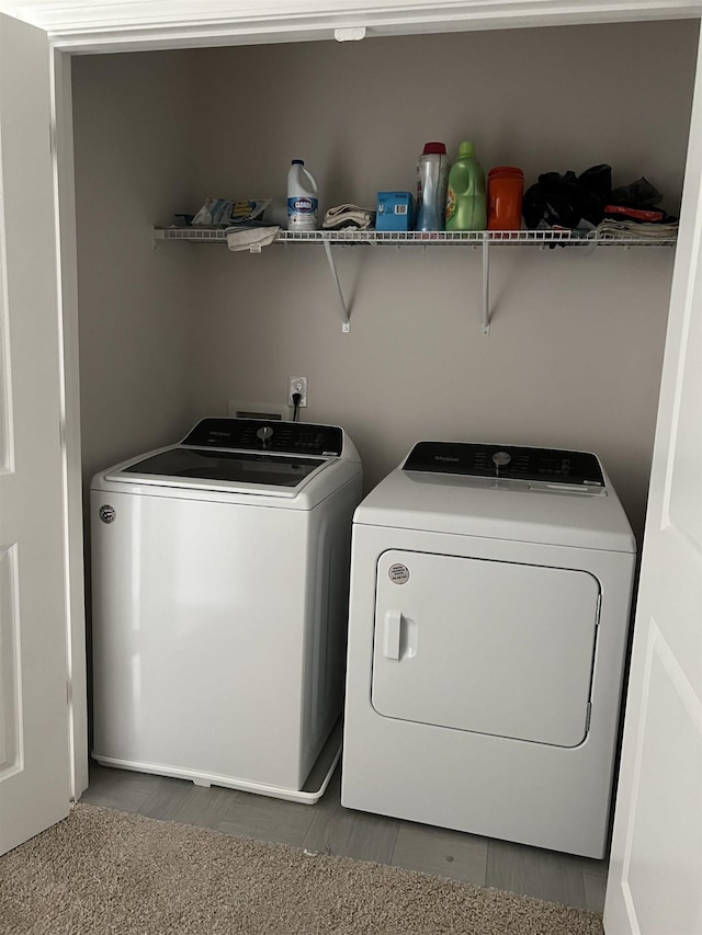 clothes washing area featuring laundry area and separate washer and dryer