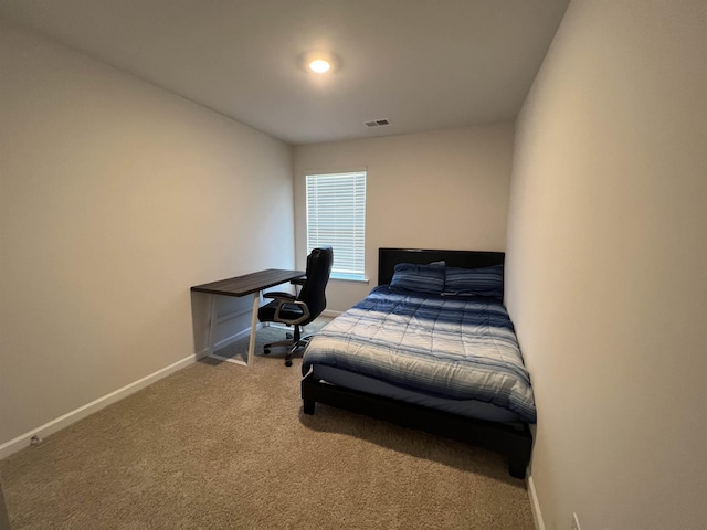 bedroom featuring visible vents, carpet flooring, and baseboards