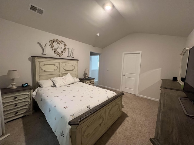 bedroom featuring visible vents, baseboards, carpet, and vaulted ceiling