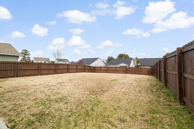 view of yard with a fenced backyard